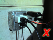 a bunch of wires are plugged into a box with an x in the corner